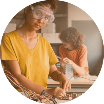 Girl working in shop class