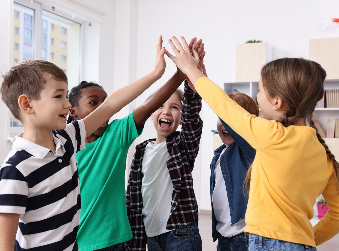Happy students high fiving