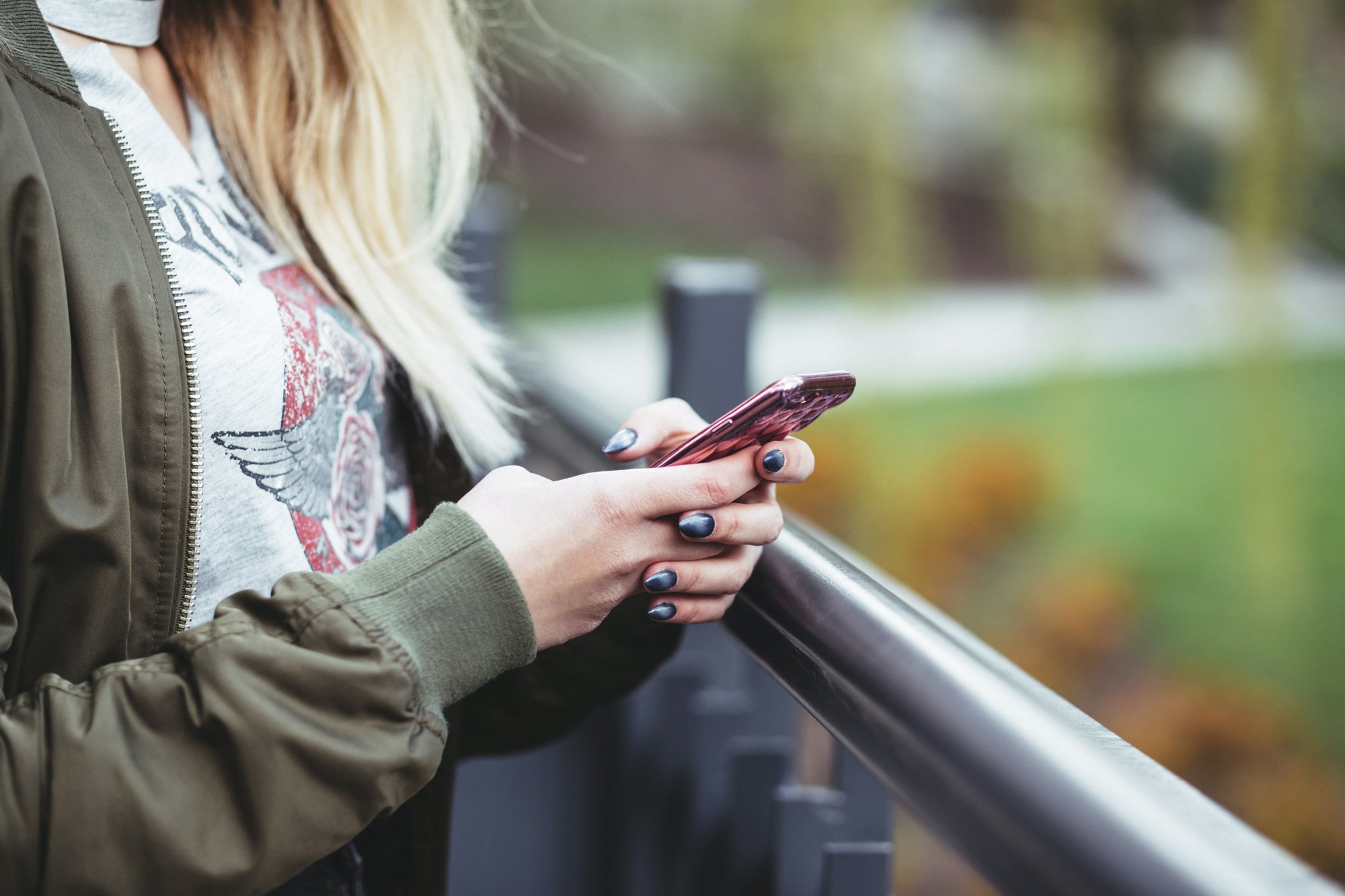 Student with a cellphone in hand